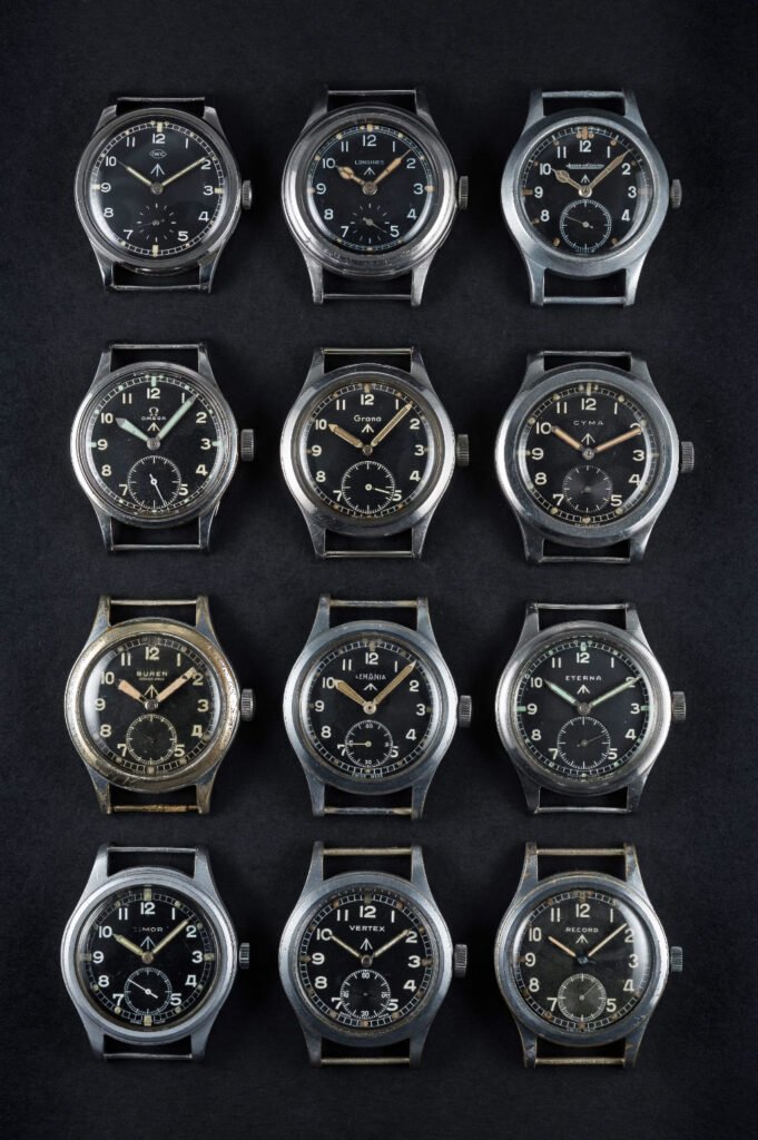 The complete set of 12 luxury Dirty Dozen military watches featuring IWC, Longines, Jaeger-LeCoultre, Omega, Grana, Cyma, Buren, Lemania, Eterna, Timor, Vertex, and Record